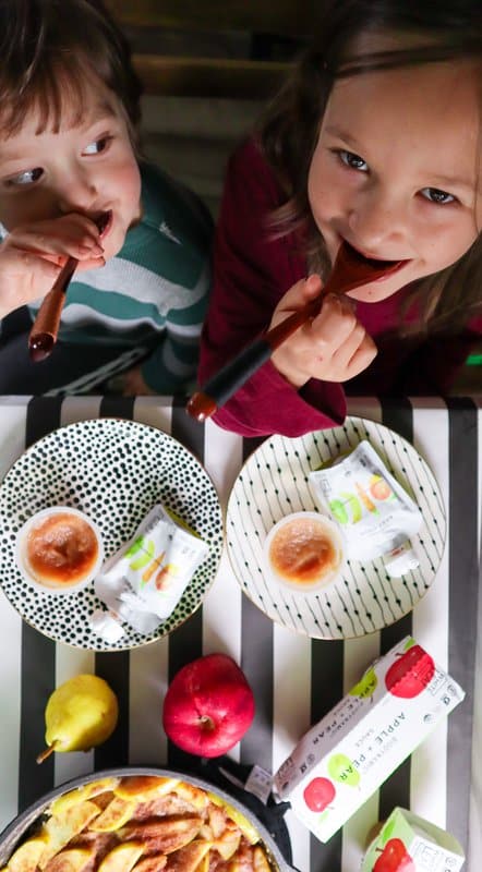 Kids enjoying pear apple sauce and organic baby food pouches from White Leaf Provision